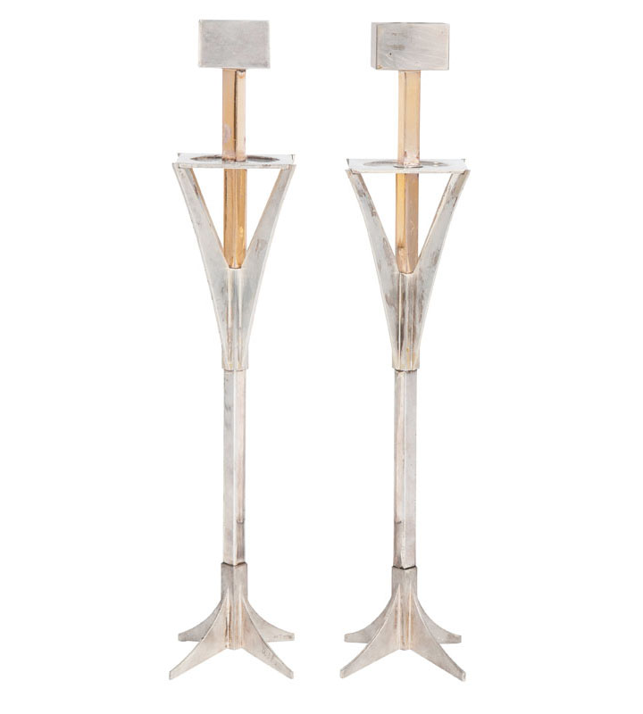 A pair of candlesticks of modern design
